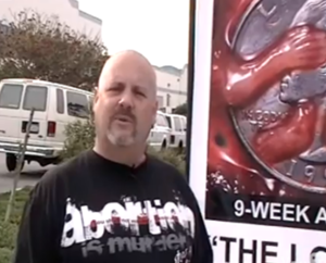 todd bullis with abortion sign.png